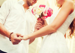 Woman receives flowers from a man